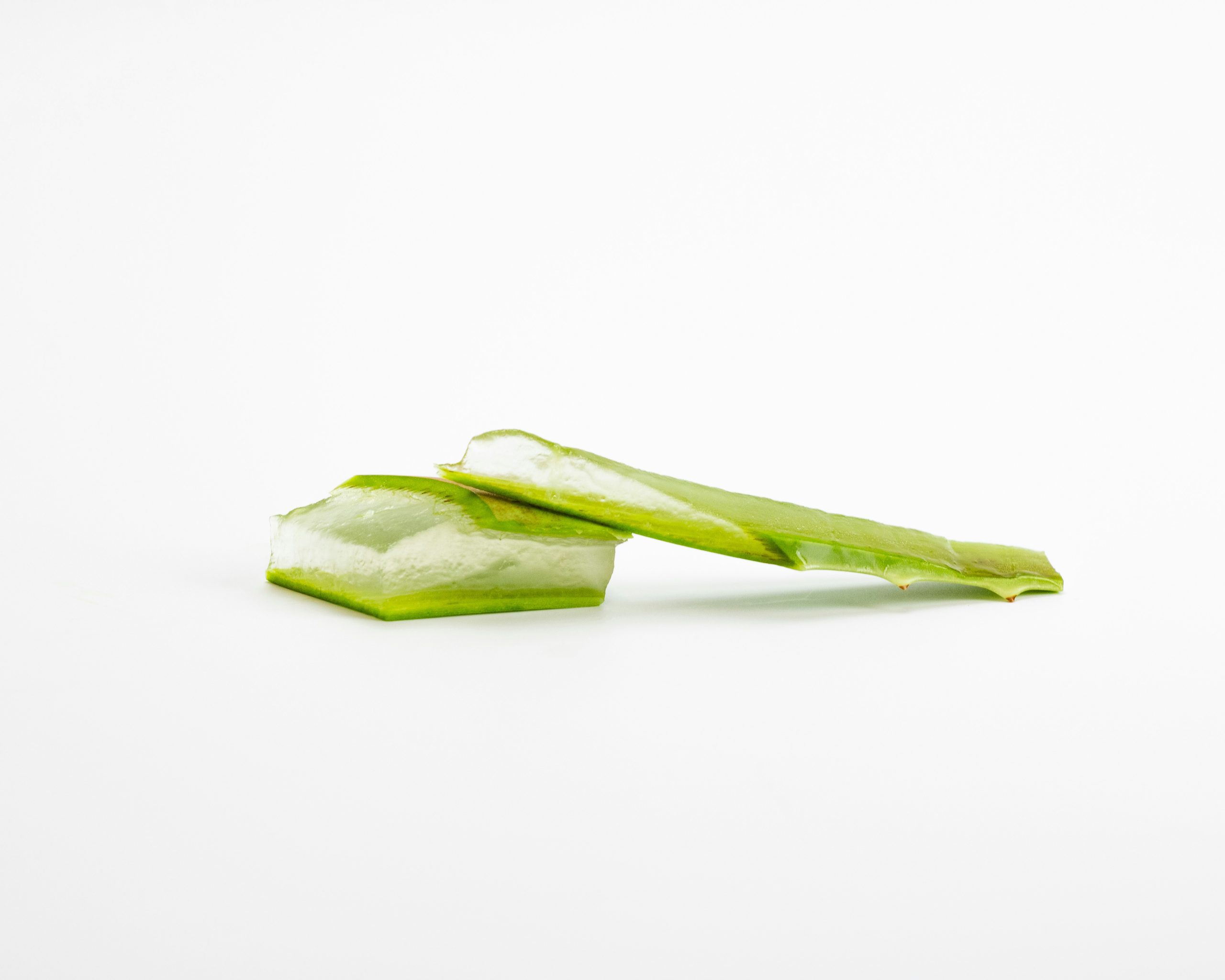 Slices of aloe vera on a white background